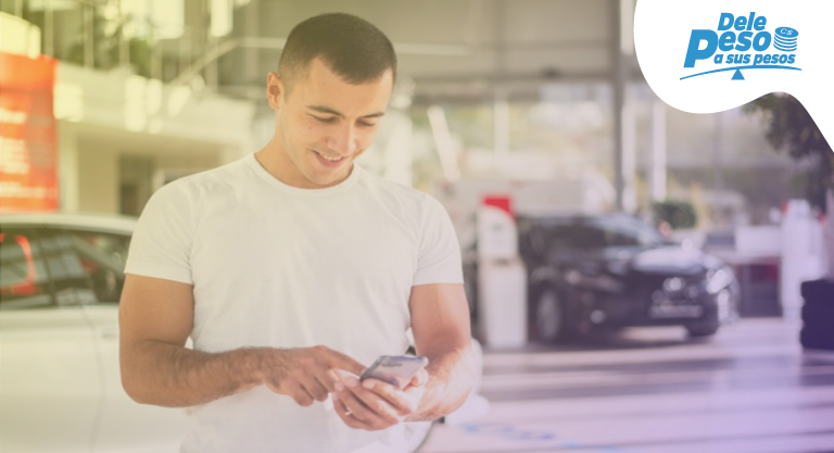 man holding calculator and reading loan paperwork